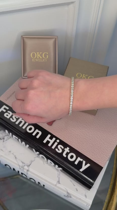 Load video: Lab Grown Diamond Tennis Bracelet 4.31 CTW Round Cut in 14K Yellow Gold | OKG Jewelry