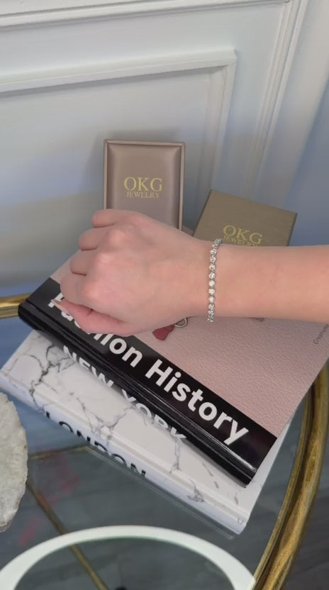 Load video: Lab Grown Diamond Tennis Bracelet 8.90 CTW E–F VS2 in 14K White Gold | OKG Jewelry