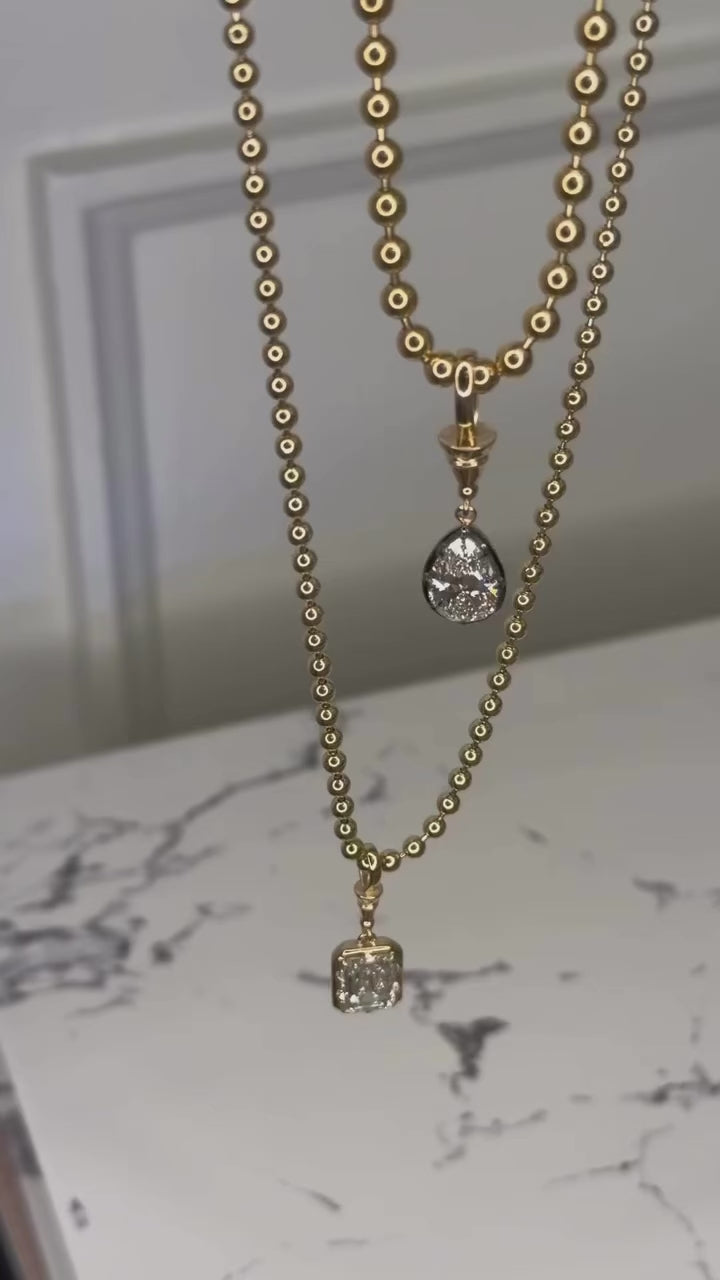 Load video: 14K Yellow Gold Black Rhodium Pear Shaped Lab Grown Diamond Necklace